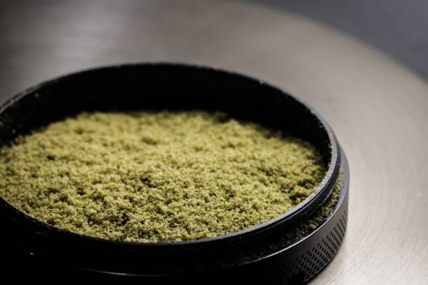 Kief collected in the bottom portion of the grinder - buy bud canada